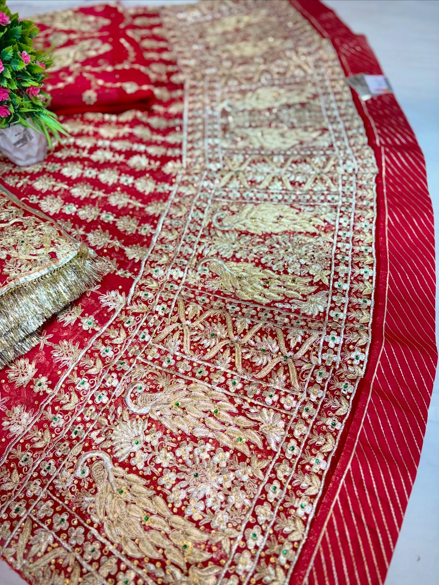 A stunning collection of traditional Indian bridal lehengas featuring rich red hues, heavy embroidery, and intricate festive designs.